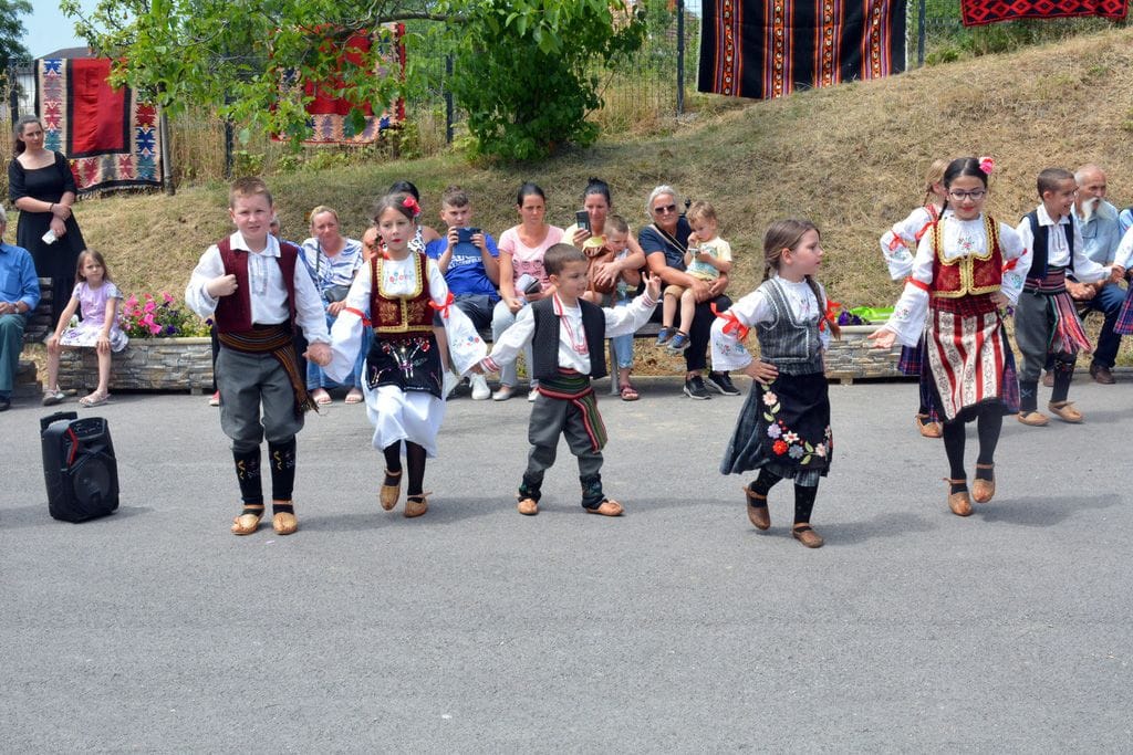 Children join in traditional dancing for the feast, Ranilović, Serbia.