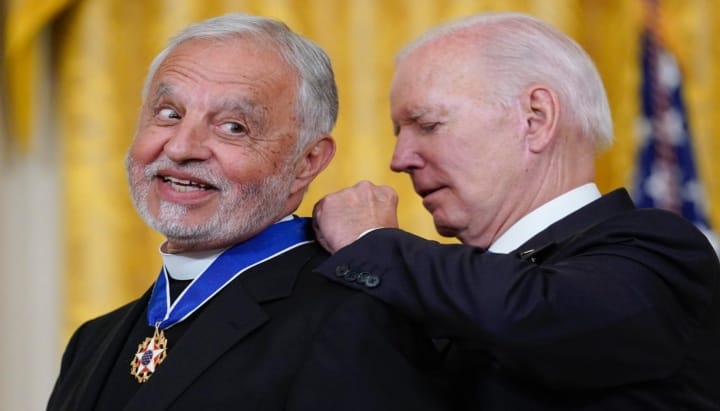 Fr. Alexander Karloutsos receives the Presidential Medal of Freedom from former President Joe Biden in 2022. Photo: AP