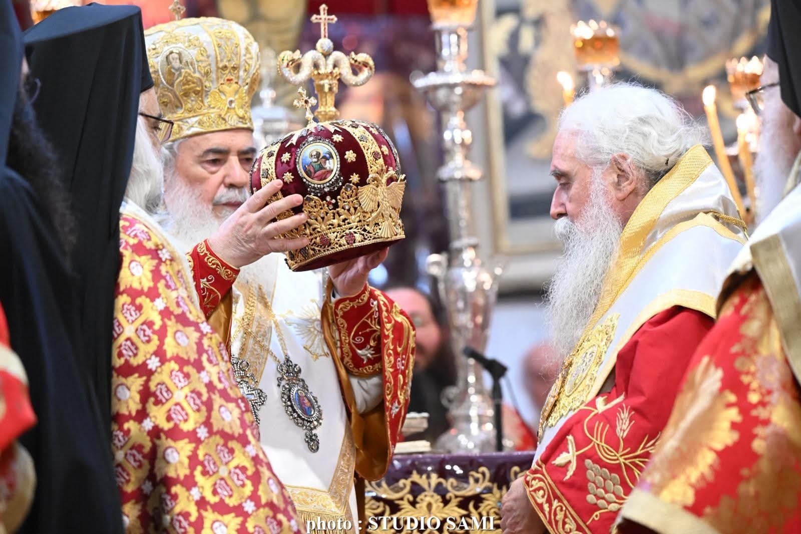 Pat. Theophilos prepares to place the mitre on the head of Abp. Symeon. Photo: Jerusalem Patriarchate