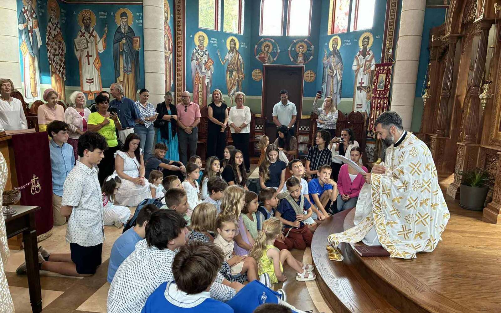 Fr. Srebrenko speaks to the children of his parish. Photo: Serbian Diocese of Eastern America