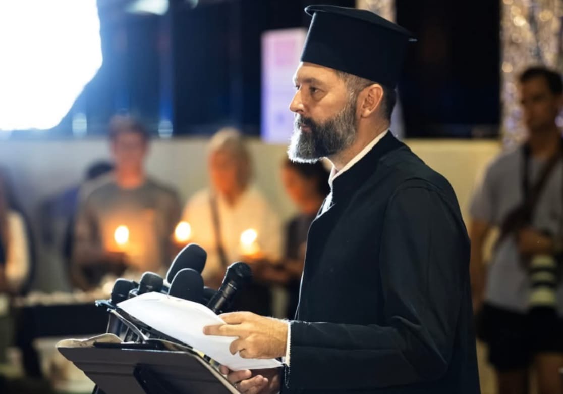 Fr. Srebrenko speaks to the crowd at the vigil for Iryna Zarutska, a 23-year-old Ukrainian refugee who was tragically killed on a train in Charlotte, making national headlines this past fall. Photo: Serbian Diocese of Eastern America