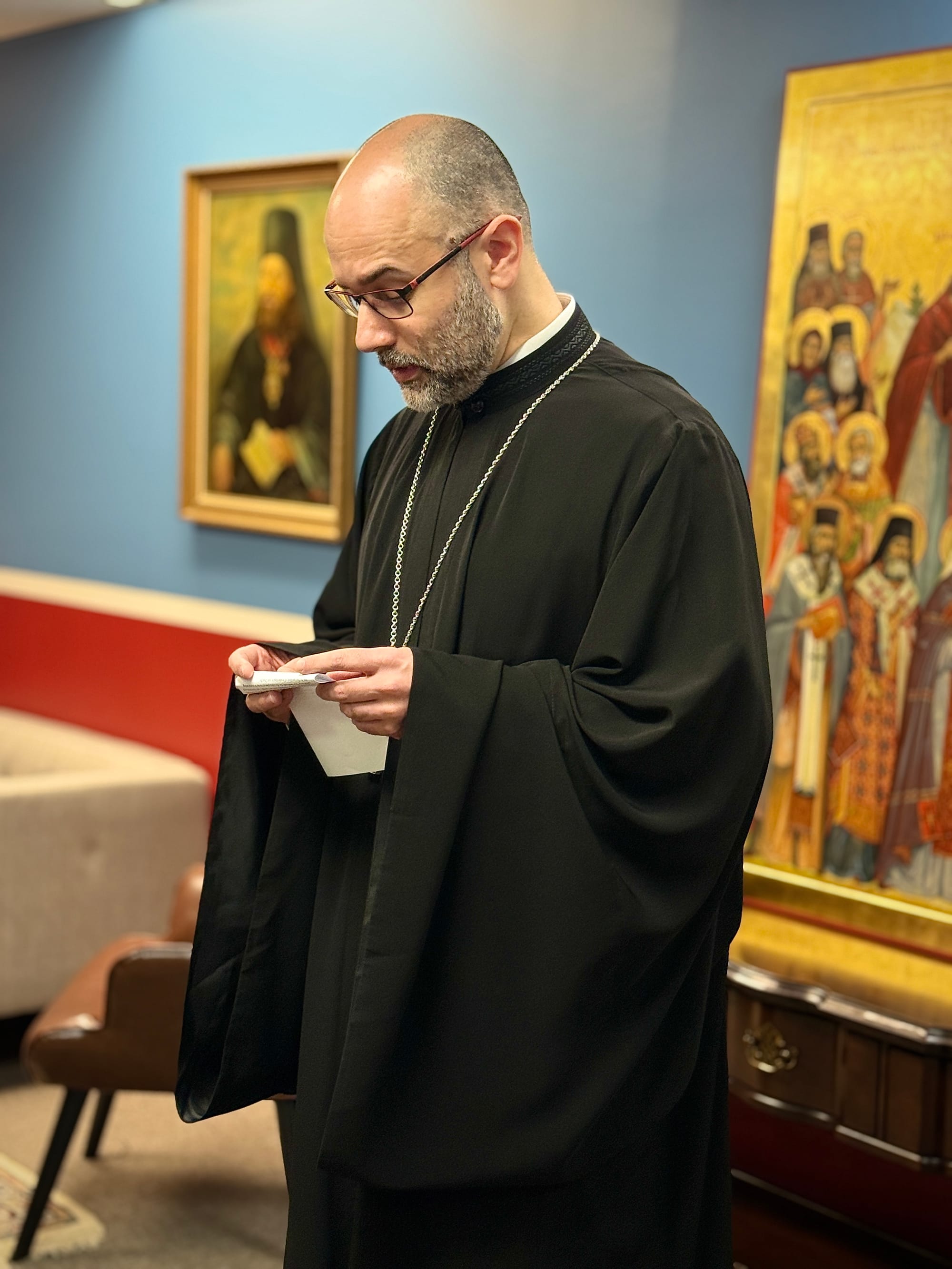 Fr. Alessandro giving remarks after his confirmation. Note the recently commissioned icon of All-Saints of North America