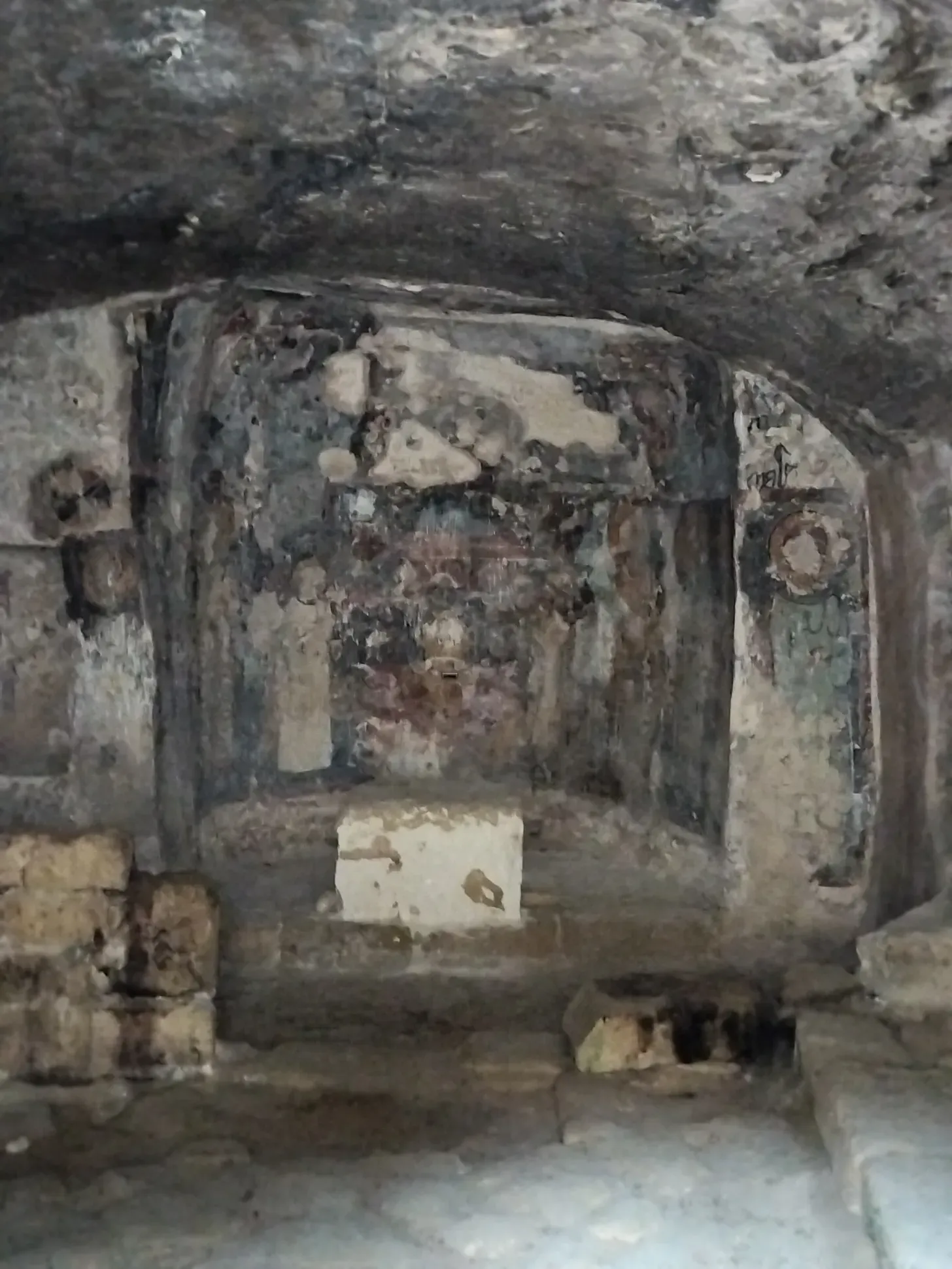 The Agia Solomoni Catacomb Church. Note the faces of the icons have been removed. Whether this is simple wear or the result of the Iconoclastic period, I do not know. The remnants of the Holy Table.