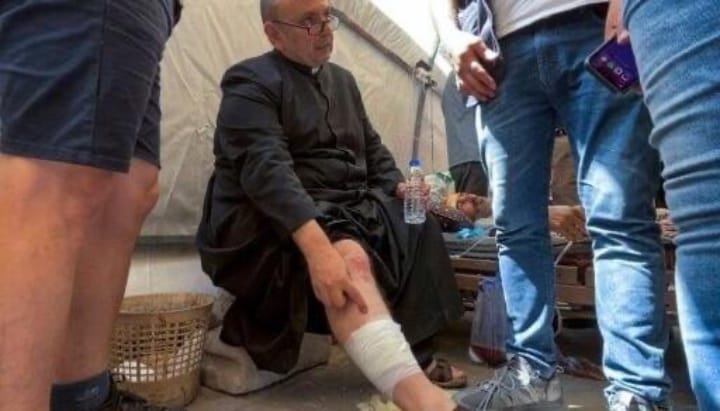 Fr. Gabriele Romanelli sustained minor leg injuries. Photo: Omar Al-Qattaa/AFP via Getty Images