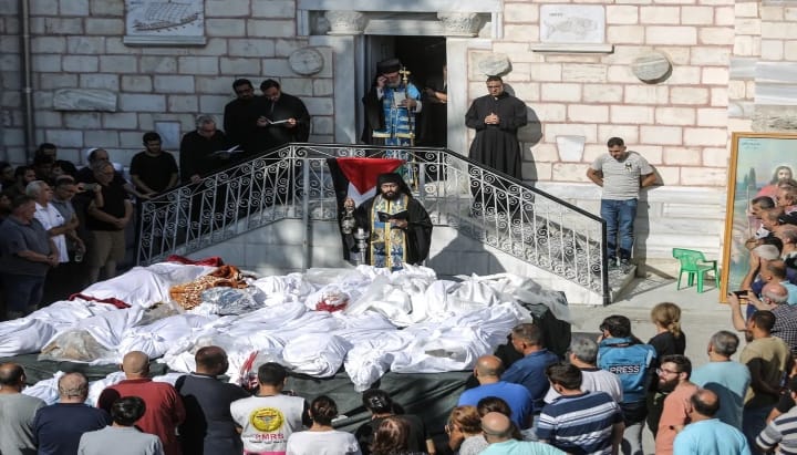 A mass funeral in the courtyard of the Greek Orthodox Church of St. Porphyrios following an Israeli strike of the historic church in October of 2023. Photo: Anadolu Agency/Anadolu/Getty Images