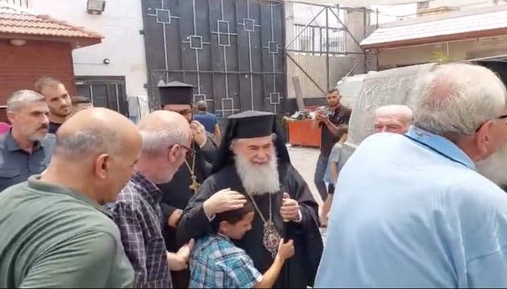 A young boy hugs His Beatitude upon his arrival. Source: Jerusalem Patriarchate