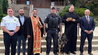 Police and seminary staff with the returned relics of St. Raphael