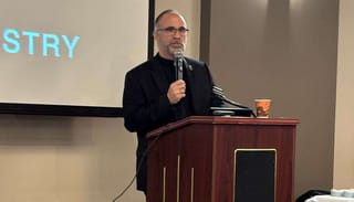 Fr. Peter Spiro speaks in Aurora. Photo: Dr. Rodney Caniglia
