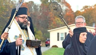 His Grace Bsp. Andrei carries the holy relics of St. Olga of Alaska. Photo: Romanian Orthodox Episcopate of America