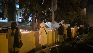Mourners lit candles outside of Caucasus Medical Center in Tbilisi, where Patr. Ilia II fell asleep in the Lord. Photo: Sota News / X