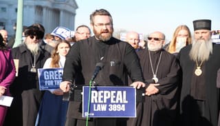 Subdeacon Gregory Levitsky closes out Tuesday afternoon's press conference. Photo: Aaron Hickman/UOJ-USA