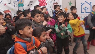 Programs for families and children offer emotional and psychological support, and help dealing with trauma, like that suffered by Rama and her family. Photo: iocc.org
