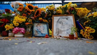Flowers, drawings, and other items continue fill a memorial site dedicated to Iryna Zarutska. Photo: Associated Press/Nell Redmond