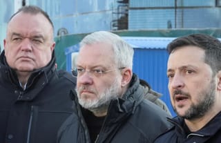 Pictured from left to right: The ex-head of Ukraine's state nuclear power company Enerhoatom Petro Kotin, Justice Minister Herman Halushchenko and Ukraine's President Volodymyr Zelensky.