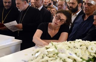 A member of the community mourns during the funeral service for Syria's new martyrs in Damascus. Photo: antiochpatriarchate.org