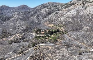 The historic Nea Moni Monastery remains unscathed in the center of a landscape that was once covered in greenery. Photo: Konstantinos Anagnostou/Reuters