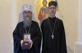 Fr. Alessandro presents relics of St. Olga of Alaska to His Beatitude Met. Rastislav. Photo: OCA