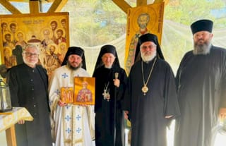 Met. Mitrofan is presented with an icon of St. Dumitru Staniloae, his former professor. Photo: Serbian Orthodox Diocese of Canada