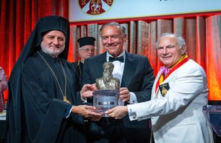 His Eminence Abp. Elpidophoros of America, together with Dr. Anthony J. Limberakis, present the Athenagoras Human Rights Award to the Hon. Michael R. Pompeo. Photo: J. Mindala/Archons