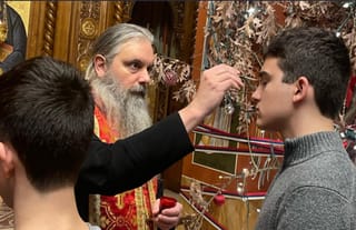 One of the youth receives Holy Unction from Bishop Serafim. Photo: Youth of the New Gracanica - Midwest Diocese/Facebook
