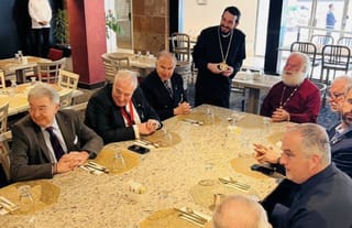 Michael Karloutsos in bottom right corner. Photo: thenationalherald.com