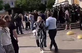 UOC believers breach cathedral perimeter in Chernivtsi.