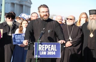 Subdeacon Gregory Levitsky closes out Tuesday afternoon's press conference. Photo: Aaron Hickman/UOJ-USA