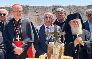 Patriarch Theophilos III of Jerusalem (center right) and Latin Patriarch of Jerusalem Pierbattista Pizzaballa (center left) participate in a prayer ceremony. Photo: Times of Israel
