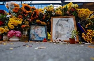 Flowers, drawings, and other items continue fill a memorial site dedicated to Iryna Zarutska. Photo: Associated Press/Nell Redmond