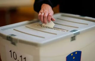 Voting at a polling station during Slovenia’s euthanasia referendum. Photo: AP/Darko Bandic