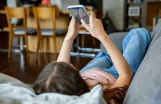 A teenager with a mobile phone. Photo: Getty Images