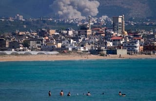 An Israeli airstrike hits the Qlaileh village (background), as seen from the port city of Tyre, Lebanon. Photo: religionnews.com
