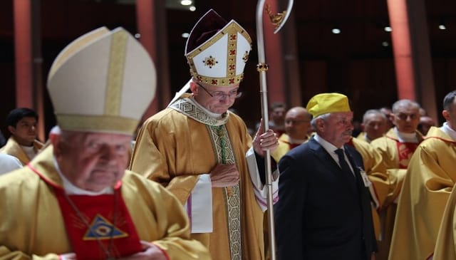 Archbishop Adrian Galbas of Warsaw, Poland, prays during Mass on March 13. Photo: OSV News/Courtesy Polish bishops' conference