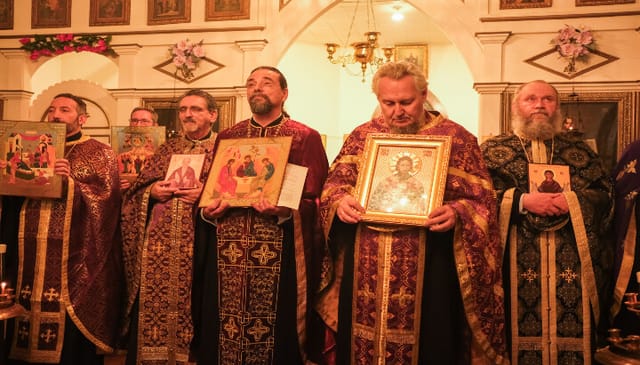 Clergy hold icons during the reading of the Synodikon of the Seventh Ecumenical Council in Galveston on Sunday. Photo: Cory Meissner