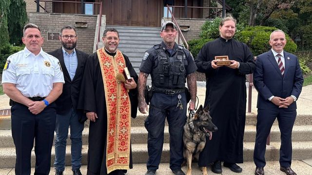 Police and seminary staff with the returned relics of St. Raphael