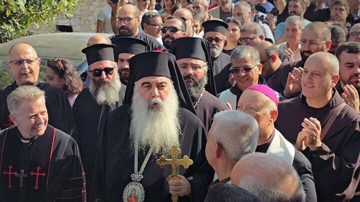 Met. Athanasios and the people of al-Ghassaniyah during the celebration of the return. Photo: SANA