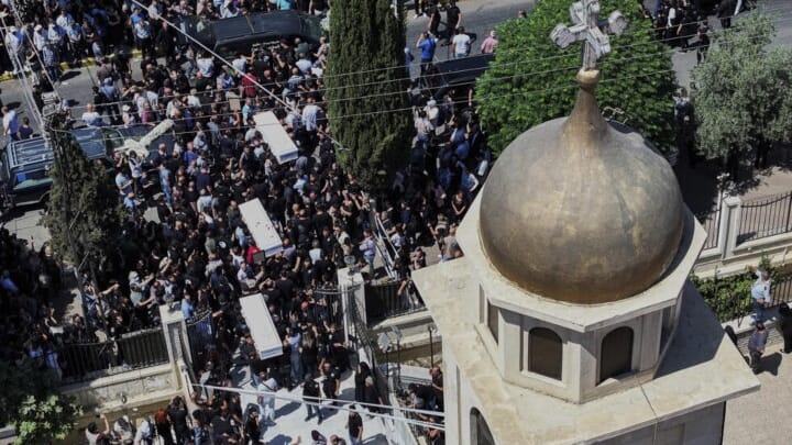 At the funeral of the martyrs of the attack in Damascus, on June 24, 2025. Photo: Ghaith Alsayed/AP