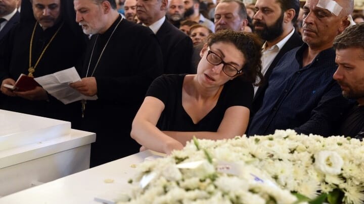 A member of the community mourns during the funeral service for Syria's new martyrs in Damascus. Photo: antiochpatriarchate.org