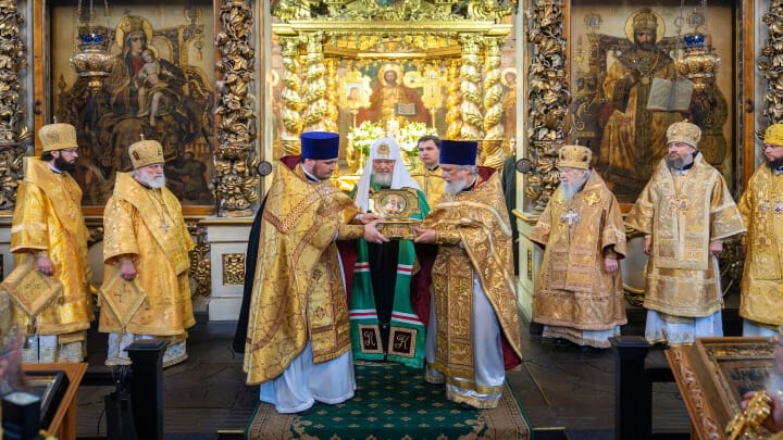 Pat. Kirill stands before the relics of St. Tikhon. Photo: ROC Commission for the Development of Pilgrimage and the Bringing of Holy Relics