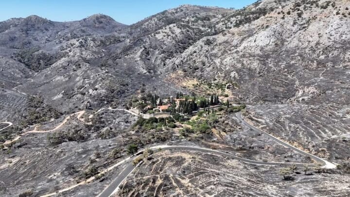 The historic Nea Moni Monastery remains unscathed in the center of a landscape that was once covered in greenery. Photo: Konstantinos Anagnostou/Reuters