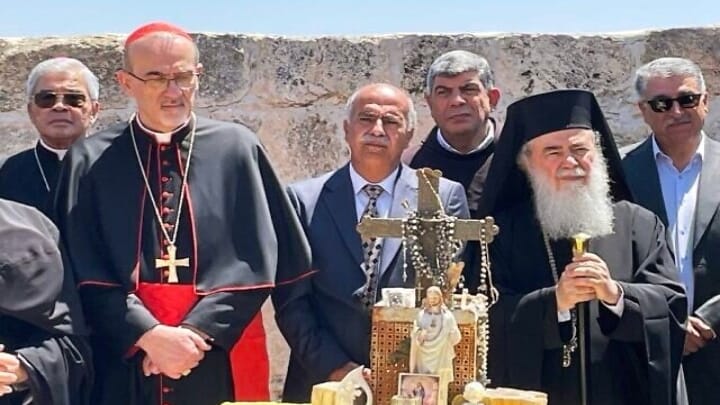 Patriarch Theophilos III of Jerusalem (center right) and Latin Patriarch of Jerusalem Pierbattista Pizzaballa (center left) participate in a prayer ceremony. Photo: Times of Israel
