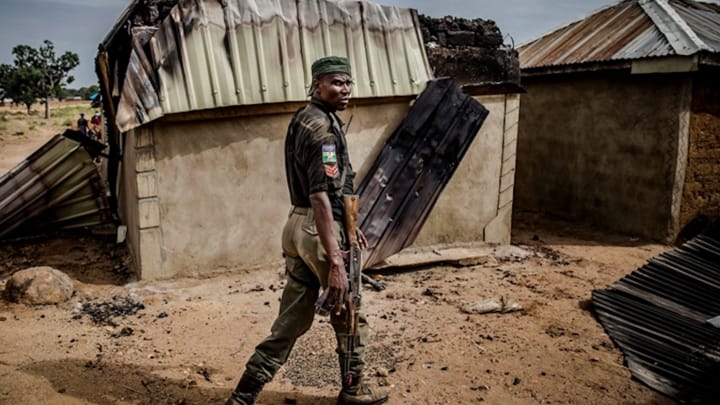 Nigerian police patrol an area of destroyed and burned houses after a Fulani attack. Photo: Christian Post