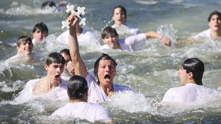 Athos Karistinos retrieves the Holy Cross. Photo: tampabay.com