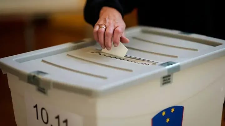 Voting at a polling station during Slovenia’s euthanasia referendum. Photo: AP/Darko Bandic