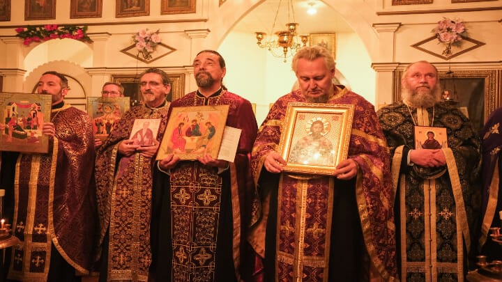 Clergy hold icons during the reading of the Synodikon of the Seventh Ecumenical Council in Galveston on Sunday. Photo: Cory Meissner
