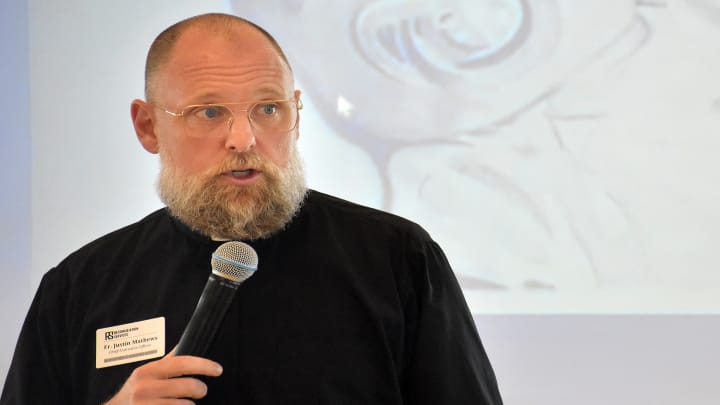 Fr. Justin Mathews speaks during an event for Reconciliation Services. Photo: Taylor Wilmore/Startland News