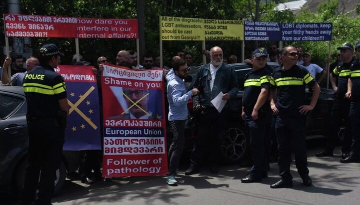 Rainbow flag torn up at a rally against LGBT propaganda in Georgian capital