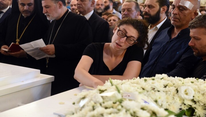 A member of the community mourns during the funeral service for Syria's new martyrs in Damascus. Photo: antiochpatriarchate.org