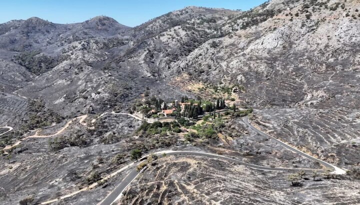 The historic Nea Moni Monastery remains unscathed in the center of a landscape that was once covered in greenery. Photo: Konstantinos Anagnostou/Reuters