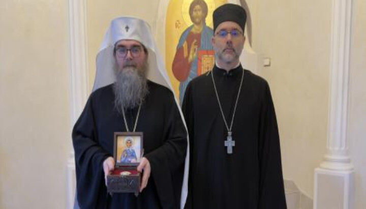Fr. Alessandro presents relics of St. Olga of Alaska to His Beatitude Met. Rastislav. Photo: OCA